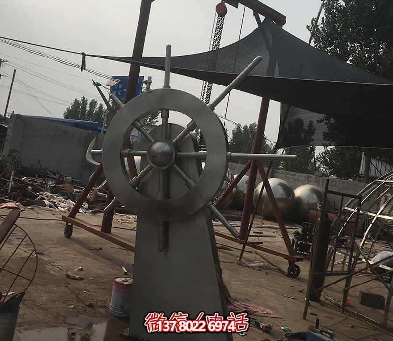 騰飛不銹鋼雕塑船舵，點(diǎn)綴室內(nèi)飯店